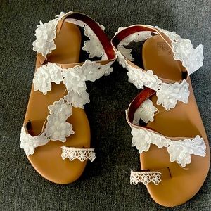 Brand new never warn lace and pearl sandals